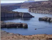  ?? RICK BOWMER — THE ASSOCIATED PRESS ?? Federal water officials have announced they will keep hundreds of billions of gallons of Colorado River water inside Lake Powell, seen above in July, instead of letting it flow downstream to southweste­rn states and Mexico.