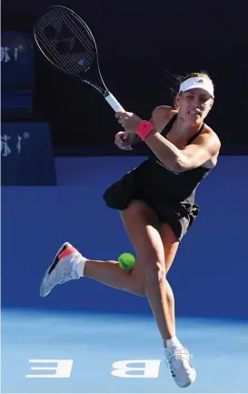  ?? — AFP ?? Angelique Kerber returns to Carla Suarez- Navarro in their China Open second round match in Beijing on Tuesday.