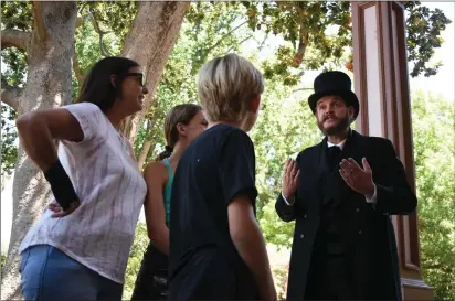  ?? KIMBERLY MORALES — ENTERPRISE-RECORD ?? Nick Anderson, dressed as John Bidwell, walks guests through local history on Saturday at the Bidwell Mansion in Chico.