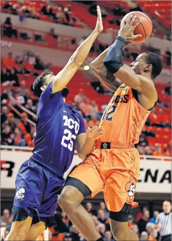  ?? [NATE BILLINGS/THE OKLAHOMAN] ?? Oklahoma State's Cameron McGriff, right, missed all seven of his shot attempts in Monday's 68-61 victory over TCU, but he still found ways to make impactful plays.