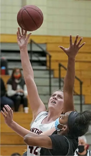  ?? Peter Diana/Post-Gazette ?? Upper St Clair’s Abby John scores over Pine-Richland’s Kaili Doctor Friday at Upper St. Clair High School.