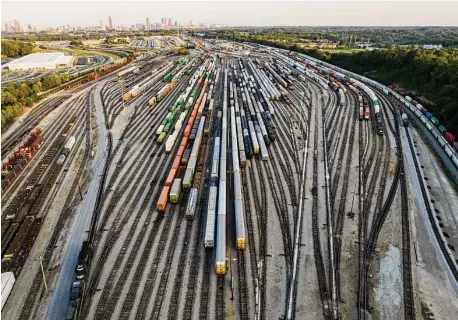  ?? Danny Karnik/Associated Press ?? Freight train cars sit in a Norfolk Southern rail yard in Atlanta. Business groups are pushing lawmakers to block a possible railroad strike before next month's deadline in the stalled contract talks.