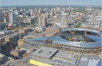  ?? EDMONTON JOURNAL/ FILES ?? Edmonton’s $ 604- million arena, shown under constructi­on last month, already has its funding in place. But with Premier Rachel Notley apparently leaving the door open to major funding for an even larger project in Calgary, the Edmonton backers may...