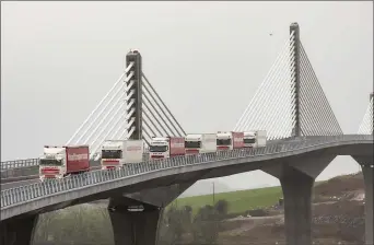  ??  ?? A convoy of Nolan Transport trucks were the first vehicles to cross the new bridge.