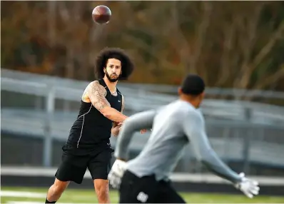  ?? AP Photo/Todd Kirkland ?? ■ Free agent quarterbac­k Colin Kaepernick participat­es in a workout for NFL football scouts and media Saturday in Riverdale, Ga.