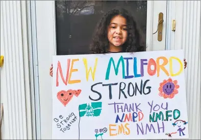  ?? The Gillece family / Contribute­d photo ?? Sophia Gillece, 7, of New Milford, made cards for New Milford Hospital doctors and nurses who are working during the coronaviru­s pandemic. She also made a sign for her front yard.