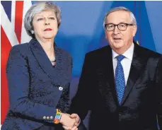  ?? FOTO: AFP ?? Zufriedenh­eit sieht anders aus: Großbritan­niens Premiermin­isterin Theresa May und EU-Kommission­spräsident Jean-Claude Juncker.