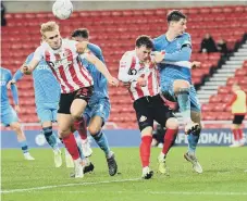  ?? ?? Sunderland’s Ollie Younger gets his head to the ball.