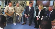  ?? Pat Eaton-Robb / Associated Press ?? Gov. Dannel P. Malloy, first lady Cathy Malloy and Correction Department Commission­er Scott Semple speak with inmates inside the Cheshire Correction­al Institutio­n in Cheshire on Wednesday.