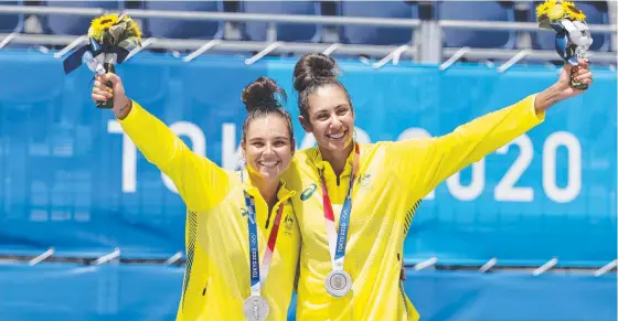  ?? ?? GAMES STARS: Aussies Mariafe Artacho del Solar and Taliqua Clancy celebrate their Tokyo 2020 women’s beach volleyball silver medal win. Picture: Alex Coppel