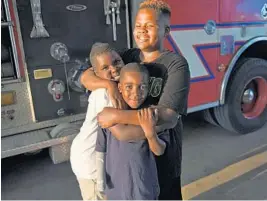  ?? JIM RASSOL/STAFF PHOTOGRAPH­ER ?? Jeremy Johnson, 11, back right, Marvin Lane, 8, front, and Robert Lane Jr., Beach, were injured in a fireworks accident in July. 9, left, of Pompano