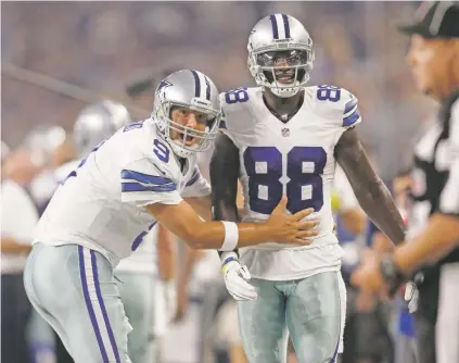  ?? BRANDON WADE/ASSOCIATED PRESS FILE PHOTO ?? Cowboys quarterbac­k Tony Romo, left, and wide receiver Dez Bryant are anxious to get on the field together after injuries kept them apart most of last season, when Dallas slid from first to worst in the NFC East.