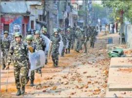  ??  ?? Paramilita­ry forces conduct a flag march at Kadam Puri in New Delhi on Wednesday.
AMAL KS/HT