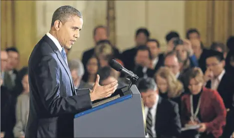  ??  ?? President Obama answers questions during a news conference yesterday in the White House.