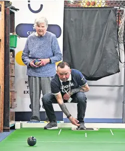  ?? ?? Sporting chance Dedicated volunteers help to run the carpet bowls sessions