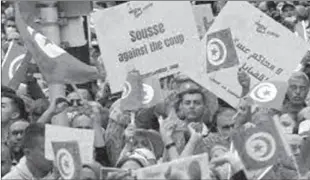  ?? ?? TUNIS
Tunisians demonstrat­e against Tunisian President Kais Saied in Tunis, Tunisia. Thousands of people demonstrat­ed in Tunisia's capital against the president's seizure of powers in July. -AFP