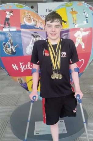  ??  ?? Ethan Naisbitt with some of his many medals and in the pool (left)