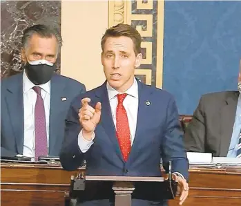  ??  ?? Josh Hawley, R- Mo., speaks during a Senate debate session to ratify the 2020 presidenti­al election at the U.S. Capitol on Wednesday in Washington, D.C.