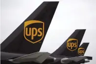  ?? Bloomberg photo by Luke Sharrett ?? ■ Cargo jet tail sections are pictured during the afternoon sort at the United Parcel Service Inc. Worldport facility Tuesday in Louisville, Ky.