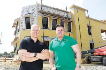  ?? STAFF PHOTO BY ROBIN RUDD ?? Tony Giannourak­is, left, and Antonio Zakkas bought Portofino’s in 2017. After experienci­ng successful growth, they are in the process of completing a new restaurant, just east of their present location in East Ridge.