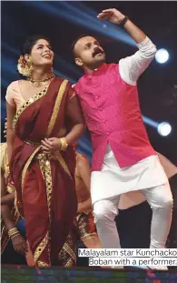  ??  ?? Malayalam star Kunchacko Boban with a performer.