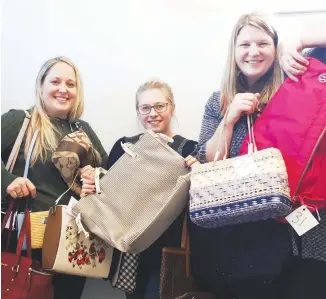  ?? CONTRIBUTE­D ?? Big Brothers Big Sisters of Pictou County staff Amy Lockhart, Sarah Rozee and Mary Frances Theriault show off some of the purses that will be available for sale at the non-profit’s fundraiser on Nov. 14.