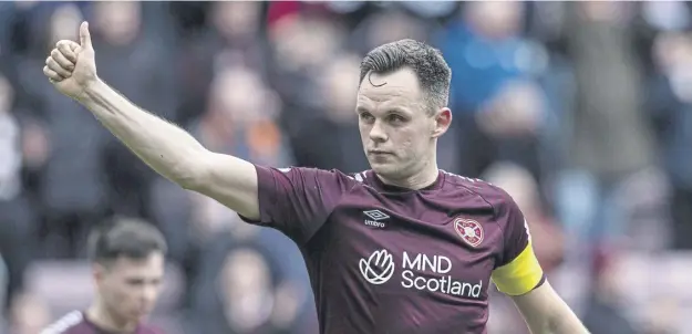  ?? ?? Lawrence Shankland celebrates Hearts’ 2-0 win over Celtic on Sunday at Tynecastle, where Scotland manager Steve Clarke was among the spectators