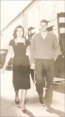  ?? Photo courtesy of John and Donna Sue Carr ?? Donna Sue Carr, left, holds hands with David Nelson at Universal Studios, where portions of -30- were recorded as well as The Adventures of Ozzie and Harriet, which Nelson starred in.