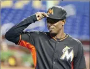  ?? WILFREDO LEE — THE ASSOCIATED PRESS ?? Miami Marlins second baseman Dee Gordon adjusts his cap as he stretches out before the start of a game against the St. Louis Cardinals last season. Gordon was traded to the Seattle Marlins for three prospects on Thursday.