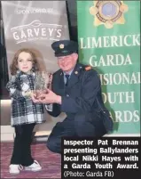  ?? (Photo: Garda FB) ?? Inspector Pat Brennan presenting Ballylande­rs local Nikki Hayes with a Garda Youth Award.