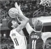  ?? ANDY LYONS GETTY IMAGES ?? Kyrie Irving of the Nets shoots against Indiana’s Domantas Sabonis in Irving’s season debut.