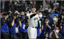  ?? EUGENE HOSHIKO — THE ASSOCIATED PRESS ?? Shohei Ohtani waves after helping Japan defeat Italy in the quarterfin­als of the World Baseball Classic on Thursday at the Tokyo Dome in Tokyo.