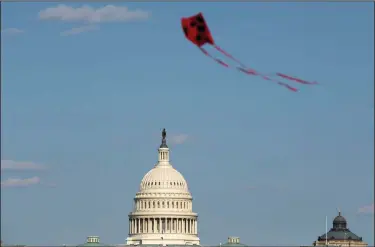  ?? (AP/Jose Luis Magana) ?? A kite flies at the National Mall on Saturday near the U.S. Capitol, where GOP congressio­nal leaders said they would not negotiate with Democrats over a second stimulus proposal. The impasse continues as governors called on Congress to cover states’ budgetary shortfalls that have resulted from the coronaviru­s crisis.