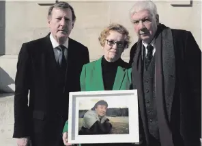  ??  ?? Lord Trimble, Ruth Dudley Edwards and Lord Bew with a photo portrait of Sean O’Callaghan