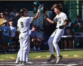  ?? PHOTO BY ROBERT CASILLAS ?? Mira Costa's Lucas Schermer, right, celebrates his solo home run against Redondo in their Bay League game on Thursday. Mira Costa went on to a 5-0victory.