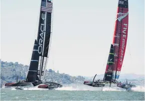  ?? PHOTO: CHRIS CAMERON ?? Oracle Team USA and Emirates Team New Zealand manoeuvre for starting positions in race 10 of the America's Cup in 2013.