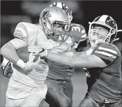  ?? Special to the Democrat-Gazette/JIMMY JONES ?? Bryant linebacker Mike Jones (right) brings down Fort Smith Southside running back Brenden Ulrich during Friday night’s game at Bryant. The Hornets won 30-19, improving to 7-0, 4-0 in 7A-Central Conference play.