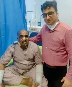  ??  ?? Dr Shashikant Mhashal, assistant professor, ENT, Cooper Hospital, Mumbai, with a Covid-19 patient, who is recovering from mucormycos­is.