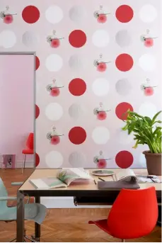  ??  ?? Portrait Homeowner Marisa Coppiano beside the velvet curtains that disguise her walk-in wardrobe Studio This work area is decorated in a pink version of the Marisa Coppiano Maison ‘Polka Dot’ wallpaper. The chairs are the ‘Maui’ design by Vico Magistrett­i for Kartell
Entrance Colourful accents, from the red ‘Corallo’ coat hanger by Michael Sodeau for Gervasoni to the purple ‘Pivot’ console by
Raw Edges for Arco, complement bold emerald walls