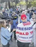  ?? MARCIO JOSE SANCHEZ / AP ?? President Donald Trump supporter Arthur Schaper (center) argues opposing views during the rally.