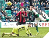  ??  ?? Martin Boyle heads home Hibs’ equaliser.