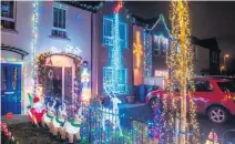  ?? MARTIN MCKEOWN ?? Magical: Racecourse Drive in Derry where all the houses have their Christmas lights on