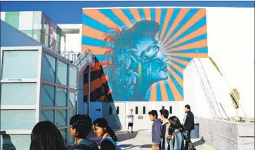  ?? Kirk McKoy Los Angeles Times ?? A MURAL at RFK Community Schools resembles the Imperial Japanese war f lag, says a community group.