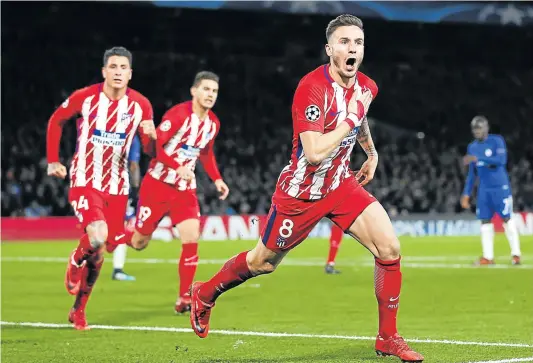  ?? Picture: AFP ?? TAKING THE GAP: Atletico Madrid's Spanish midfielder Saul Niguez celebrates after scoring during a Uefa Champions League Group C match against Chelsea at Stamford Bridge in London on Tuesday night