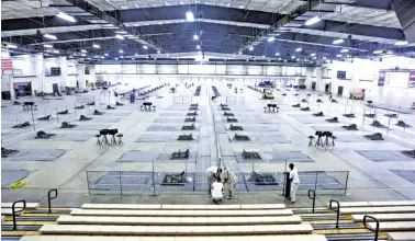  ?? PHOTOS BY MICKEY WELSH/MONTGOMERY ADVERTISER VIA AP ?? The Cramton Bowl Multiplex in Montgomery, Ala., is prepared for the National Horseshoe Pitchers Associatio­n World Horseshoe Tournament. The event began Monday and runs until Aug. 6.