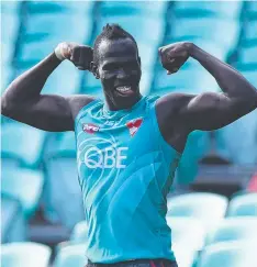  ??  ?? BIG JOB: Sydney’s Aliir Aliir flexes his muscles at training.