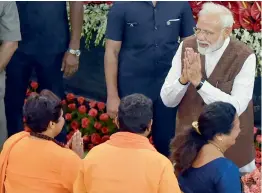  ?? PTI ?? Prime Minister Narendra Modi being greeted by Pragya Thakur during the NDA parliament­ary board meeting at Parliament House in New Delhi on Saturday. —