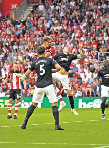  ??  ?? Heads up: Jannik Vestergaar­d outjumps Victor Lindelof to score the equaliser