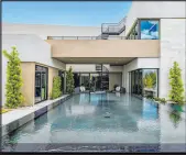  ?? ?? The show home features an oversized infinity pool and a spa.