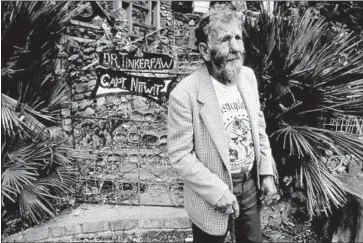  ?? Saving and Preserving Arts and Cultural Environmen­ts ?? ART BEAL in front of Nitt Witt Ridge in Cambria, a home he built almost entirely of found objects and trash.